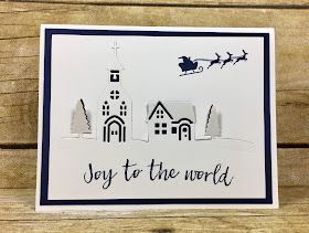 This navy and white Christmas card uses Stampin' Up!'s Hearts Come Home stamp set and Hometown Greetings Edgelits (bundle!).  We also used Clear Wink of Stella on the trees.  The top fo the church is secured down with a Mini Glue Dot.  #stamptherapist #stampinup www.stamptherapist.com