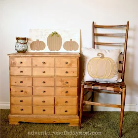 cardboard pumpkins sign on a "card catalog" dresser