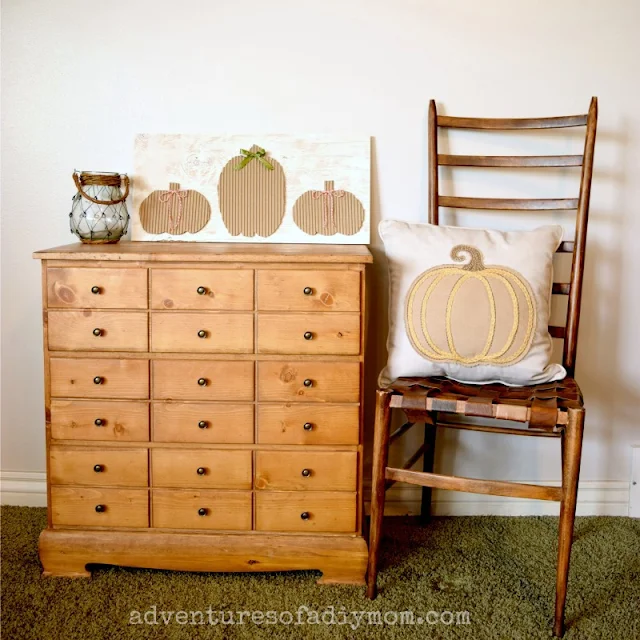 cardboard pumpkins sign on a "card catalog" dresser