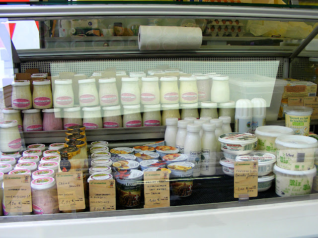 Creams and yoghurts on a cheese stall at Loches market. Indre et Loire. France. Photo by Loire Valley Time Travel.