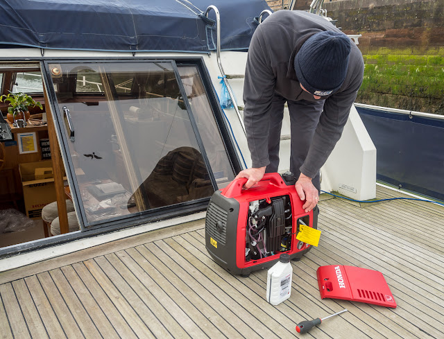 Photo of Phil checking out the new generator on Ravendale's aft deck