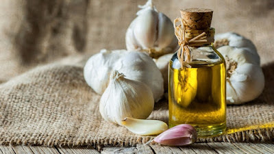 Strain the garlic oil through a fine-mesh sieve or cheesecloth into a clean jar or container.