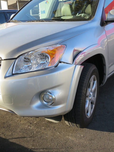 Dented fender and scraped bumper on 2012 Rav4 before collision repairs at Almost Everything Auto Body