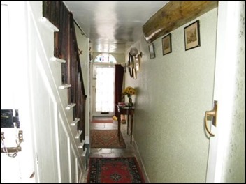 Hallway in woodchip, with one beam showing, this is now stripped back to beams brickwork and limestone with flagstone flooring 5069_WAW100048_IMG_01_0003_max_656x437