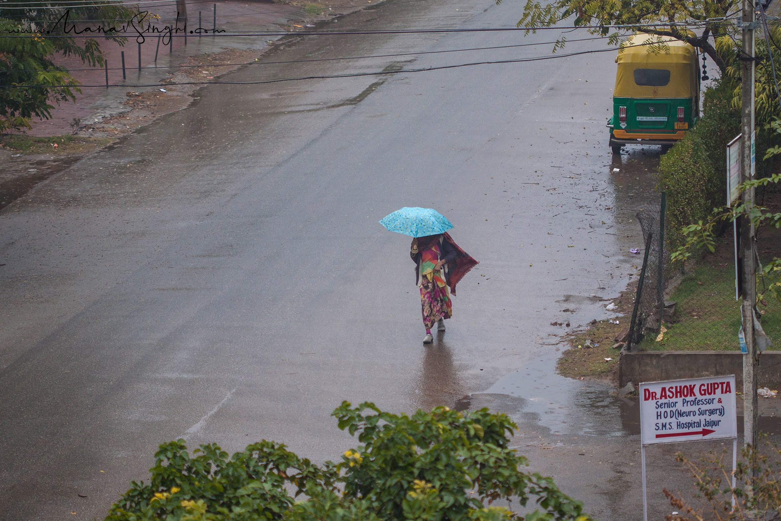 Rainy Winter Morning Woman and Blue Umbrella Jaipur