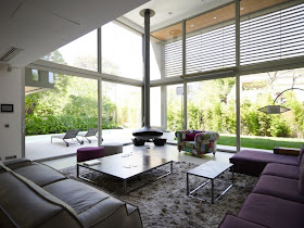 Modern living room with glass walls 