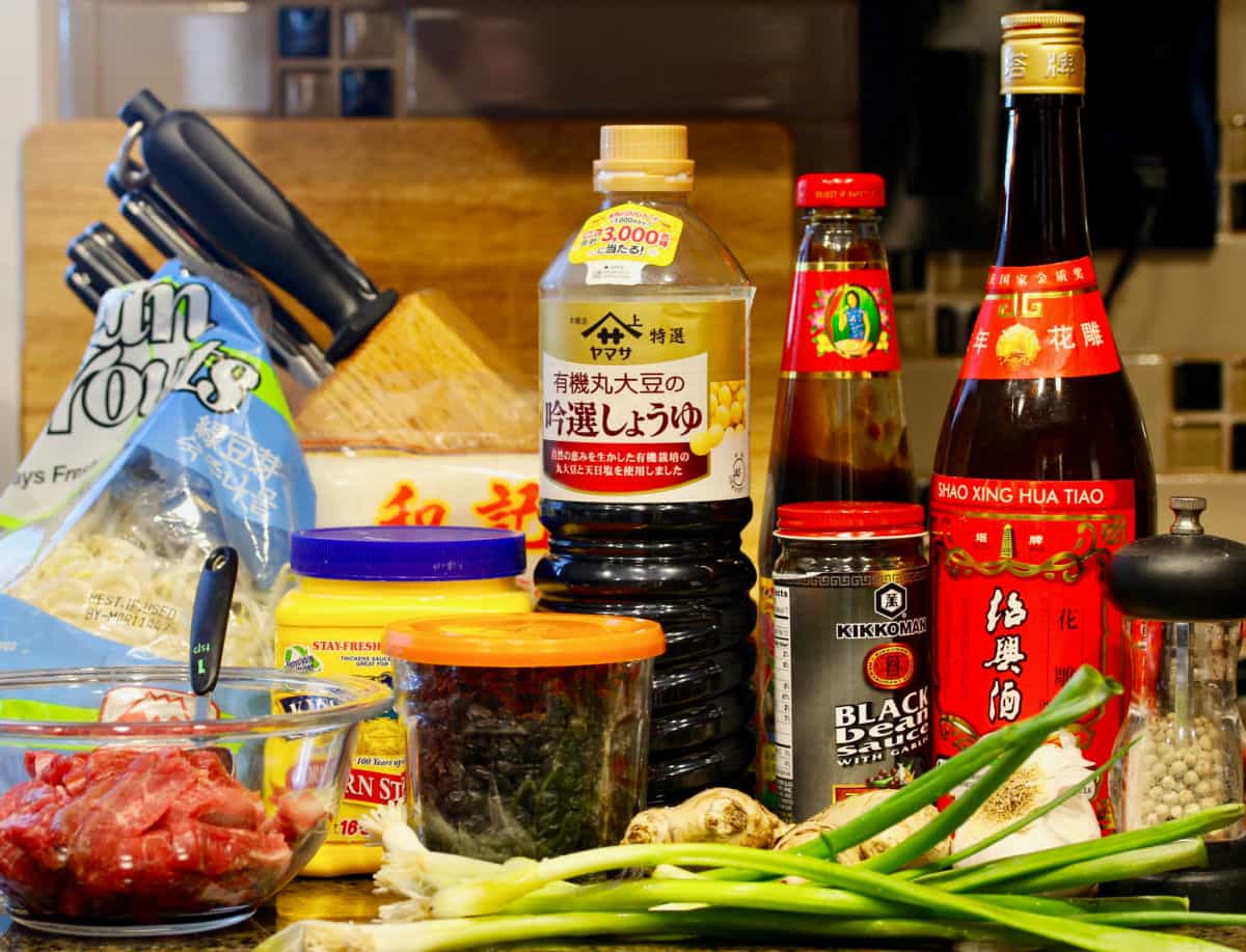 Beef Chow Fun ingredients on the kitchen counter.