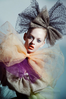 woman wearing multiple bows, holiday beauty photography