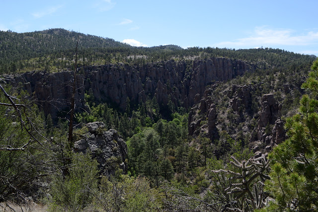 smooth hills cut by a deep canyon