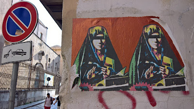 Palermo street art:  duplicated Virgin Mary mimics Antonello da Messina's Virgin Annunciate and is by Domenico Tirino aka Naf Mk.