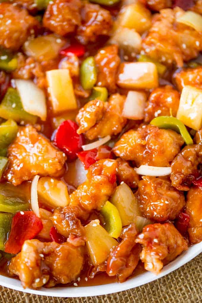 Sweet and Sour Chicken with crispy chicken, pineapple and bell peppers just like your favorite takeout place without the food coloring.