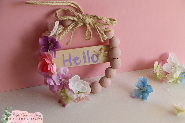 Mini beaded wreath with faux flowers