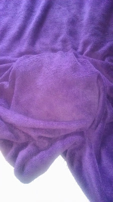 This only looks like a lumpy purple blanket