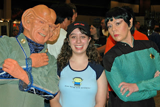 Teenager in between Star Trek cosplayers