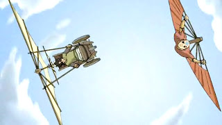 Teo, a boy in a wheelchair with a gliding contraption attached on top, tilted left parallel to Aang, tilted right under his glider fan, both soaring against a bright blue sky