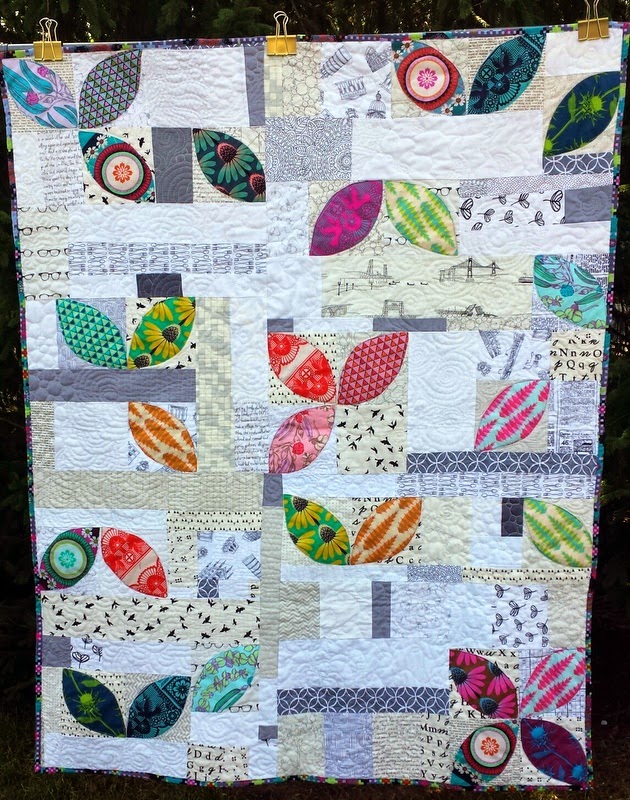 http://quiltyhabit.blogspot.com/2014/07/scatter-finished-orange-peel-quilt.html