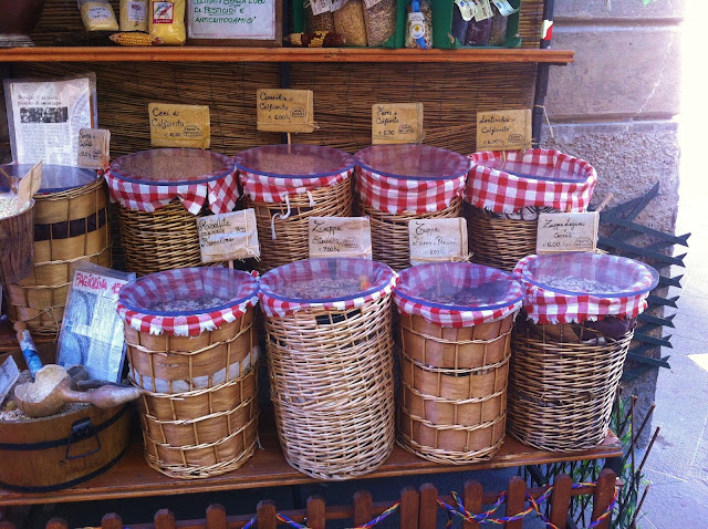 Baskets of dried beans in Tuscan grocery store