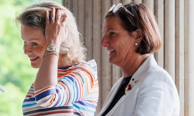 Queen Mathilde wore multicolored dress from Natan. King Philippe and Queen Mathilde held a reception for Paralympic athletes