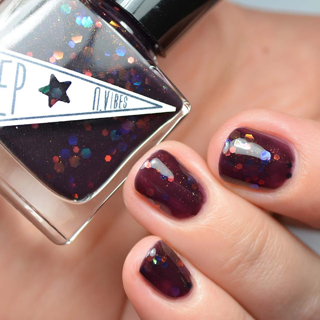 oxblood nail polish with iridescent glitter