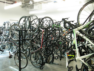 Vertical bike racks, filled to capacity in a bike storage room, Sunnyvale, California