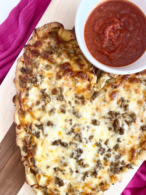 Beefy Valentine's Day Pizza...a fun to create a romantic dinner for two or your family! A sweet, thicker style crust, spices, beef and cheese. Make this heart shaped pizza soon!