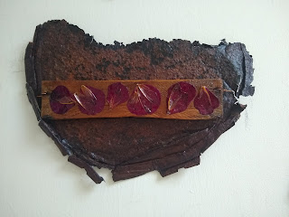 Cicada wings and rose petals on rust