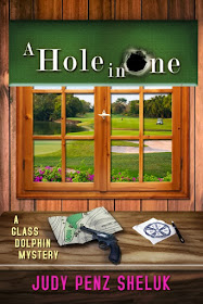 A Hole in One (A Glass Dolphin Mystery Book 2) by Judy Penz Sheluk