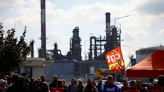 In defiance of the government, French oil refinery workers vote to continue the strike The striking French oil refinery workers to demand higher wages decided to continue their protest movement, in defiance of the government, which began summoning some of them to force them to return to work.  The striking French oil refinery workers voted, on Wednesday, to continue their protest movement in defiance of the government, which began summoning some of them, to force them to return to work in an attempt to resume pumping supplies.  The union movement demanding wage increases paralyzed six of the seven fuel refineries in France, which led to a shortage of gasoline and diesel, which exacerbated the rush of drivers to buy these materials.  Having previously threatened to use its emergency powers that would enable it to summon essential workers and force them to return to their workplaces, the government announced Wednesday that it would use those powers as strikes entered their third week.  Employees of the fuel depot at the Gravanchon-Port-Gerome refinery in northwestern France, owned by the US giant ExxonMobil, will be the first to be directed to the government's order, an energy ministry official told AFP.  The official added that "in the face of the continuing strike by some workers in Port Jerome in Normandy, the government began to order essential workers in the warehouse to return to work."  Workers who refuse to comply with the summons will face a fine or a prison sentence.  The government also said it would hold an emergency meeting on the crisis on Wednesday, as queues continued at gas stations to block traffic on the streets of Paris and major major cities.  As of Tuesday evening, 31% of stations across the country lacked at least some type of fuel, and the figure was 44% in the Paris region.  Esther Biribi, who works in the capital's healthcare sector, had hoped to find petrol at the third stop she had been to since 7am.  "I feel angry and worried," she told AFP, adding, "I understand that they want higher salaries, but I don't understand how they stop the wheel of an entire country."  - Growing resentment  The left-wing General Confederation of Labor (CGT), which is leading the strikes, announced Tuesday that any recall would be "unnecessary and illegal", raising the prospect of legal appeals.  The union is demanding a 10% pay rise for Total Energy employees, with retroactive effect for all of 2022, and says management has refused to enter into talks.  "It's easier to issue a summons to our CEO and bring him to the negotiating table," said Germinal Lanslan, CGT union president for ExxonMobil at the Gravanchon-Bourg-Gerome refinery.  Total Energy said on Wednesday that it would meet all union representatives, after it had previously stressed that it would only meet with those who agreed to end the strike.  The government has so far refrained from fueling the conflict, but in the past few days officials have had to acknowledge the growing discontent and economic damage caused by drivers waiting for hours to refuel their cars.  "Oil is very important to us. Last week was a nightmare," a driver named Santiago told AFP in Paris.  The crisis in France comes against the backdrop of a sharp rise in energy prices and inflation, while the huge profits achieved by Total Energies caused an escalation of anger and calls for the imposition of an exceptional tax on the energy group.  Even if key employees are ordered to return to operating the oil refineries, "it would take at least two weeks" to restore the strained energy supply outside Marseille, Gilles Villard, representative of Esso's CGT union at the Vos-sur-Mer refinery, said.  This crisis could add momentum to a march that left-wing political parties plan to organize on Sunday against the policies of President Emmanuel Macron and the huge rise in the cost of living.  "I hope this will spark a general strike," Green Party MP Sandrine Rousseau told France Info radio on Wednesday.  The crisis comes as Macron seeks to push ahead with a controversial pension reform by the end of winter, despite warnings from some allies of the dangers of widespread opposition.  Labor unions and left-wing political parties vowed to seek to block the reform, which would raise the retirement age from the current 62 to 64 or 65 for the majority.