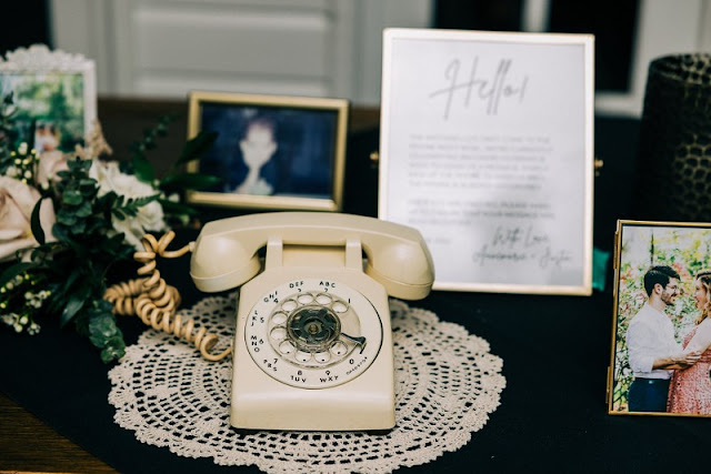 rotary telephone on cream dolly at wedding reception