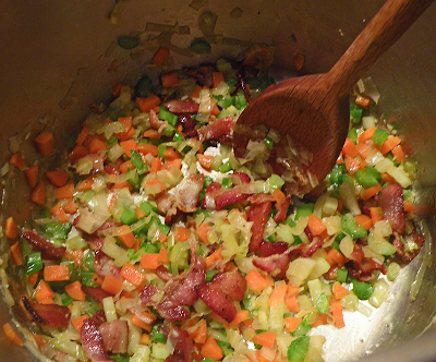 Sauteed chopped carrot, celery, and leeks, with bacon