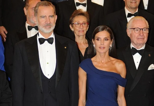 Queen Letizia wore a her Carolina Herrera royal blue maxi gown. Jimmy Choo gold leather sandals. Magrit gold clutch