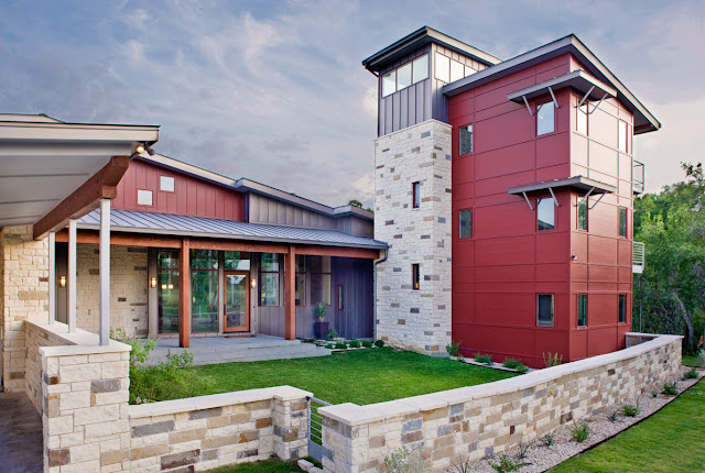 Picture of contemporary ranch house with stone facade and small lawn in front of the house