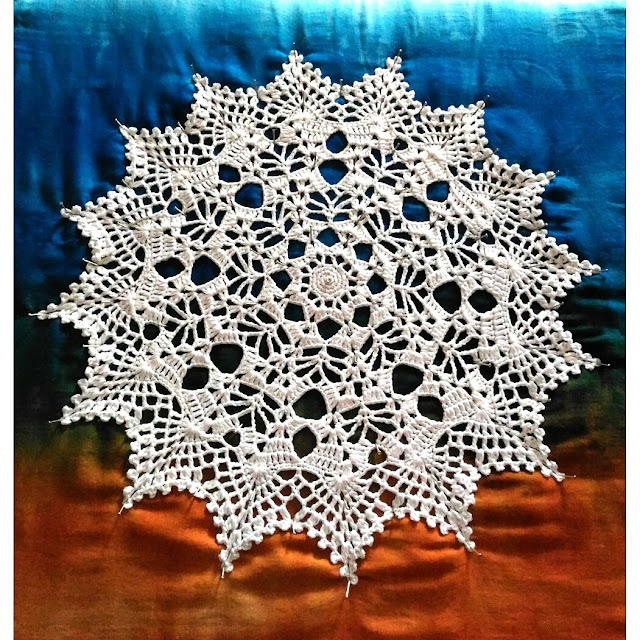 Crocheting and blocking my Solar Brilliance doily by Julia Hart of Draiguna. crochetandknitstudio.blogspot.com