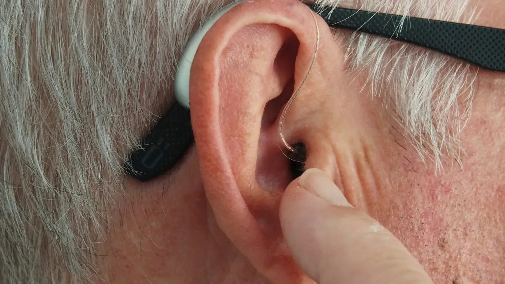 Representational - Old man wearing hearing aid