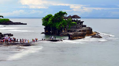 tanah lot temple in bali and visitor