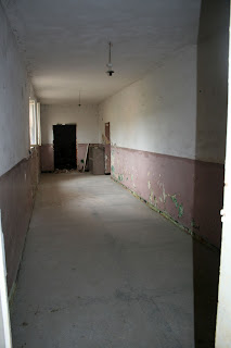 The downstairs corridor behind that door