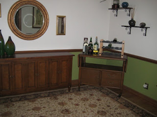 corner of the dining room - see the blue pot they broke up on that second shelf?