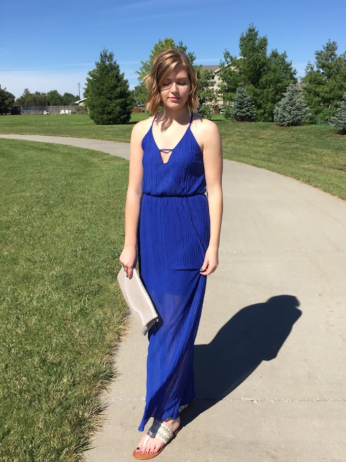 A cobalt blue maxi dress with cutouts for a subtly sexy evening look. 