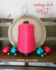Teal and pink decorations on a vintage sled shelf via http://deniseonawhim.blogspot.com