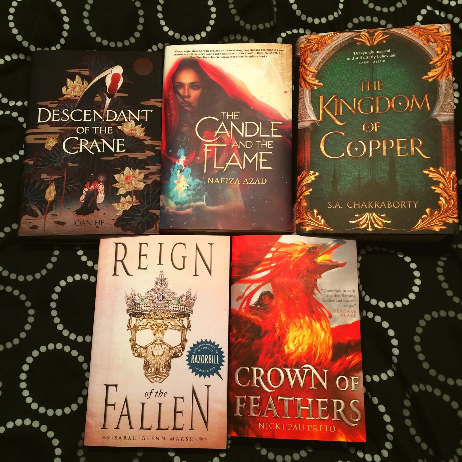 Photo of Descendant of the Crane by Joan He, The Candle and the Flame by Nafiza Azad, The Kingdom of Copper by S. A. Chakraborty, Reign of the Fallen by Sarah Glenn Marsh, and Crown of Feathers by Nicki Pau Preto