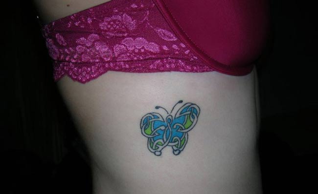 flower side tattoo. Butterfly Tattoo Design On The Side Body