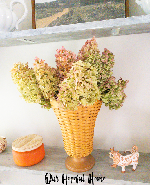 Longaberger basket vase filled with dried hydrangeas