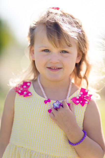  Often, our family pictures consist of posed photos from holidays and special occasions.   But as a lifestyle photographer, it is my desire to capture a visual documentation of  childhood in-the-making.  I never know what the results will be going into a session with children, as my process is kind of a wait-and-see-who-they-are-and-what-they-like-to-do kind of approach.  And as a result, I'm usually able to get a couple of nice shots with the children looking at the camera with authentic smiles.  But mostly what I capture is a whole bunch more showing their unique expressions and glimmers of who they are on the inside.               On this warm, spring day Kala brought her two delightful and energetic daughters, ages 5 and 3, to Will Rogers Park for a photo shoot.  As soon as they emerged from their vehicle in pretty summer dresses, I noticed how the girls had adorned themselves with plastic rings, bracelets and necklaces to make their outfits complete!  Kala also brought a change of clothes...each of their favorite dresses.  She said they would wear them every day if they could!  This would be the perfect outfit for capturing them at this age!   And made me laugh as I remembered my own favorite item of clothing at that age...my beloved Fonzie (from Happy Days) shirt with his two thumbs sticking up saying, "Ayyy!"            As we walked along the rambling paths through the park, the girls ahead of us scampering over rocks and bridges, Kala said both girls were like night-and-day.  One loves to have her picture taken, while the other is a complete tomboy.  Can you guess which is which?            "Sisters are for life.  She is the only person in the world who shares my memories of our childhood, our parents, our struggles, our sorrows, and yes, even our moments of happiness and triumph.  My sister is the one person who truly knows me, as I know her."   --Lisa See, Shanghai Girls           If you would like to capture some of these same "real life" moments in your family, please visit my Family page at MichelleValantinePhotography.com.  