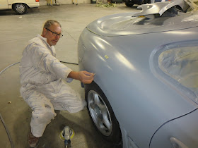 Body technician finishing dent repairs on 1995 Toyota Supra at Almost Everything Auto Body