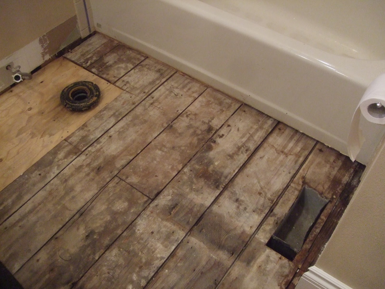 The Smiths: Laying bathroom wood flooring