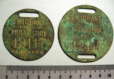 PA Railroad round metal baggage tags marked "emigrant" (19th century?)