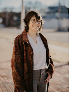 woman wearing brown coat, open