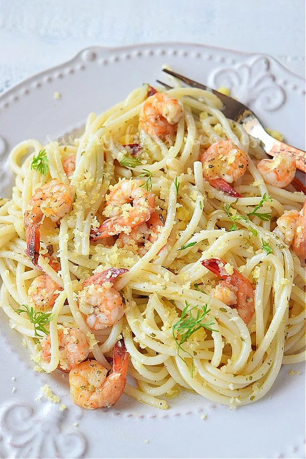 close up of a plate with shrimp scampi with pasta