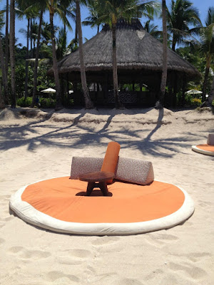 Orange sun beds in Banyugan Beach