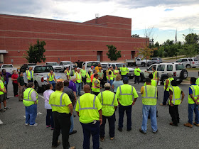 The Sign Sweep team in the parking lot for instructions and assignments.